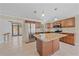 Bright kitchen featuring an island with granite countertops, stainless steel appliances and tile flooring at 2226 Fairfield Ave, Sarasota, FL 34232
