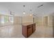 The well-lit living room features tile floors and a ceiling fan for added comfort at 2226 Fairfield Ave, Sarasota, FL 34232