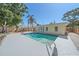 Inviting in-ground pool with a spacious deck, surrounded by mature trees and lush landscaping at 2226 Fairfield Ave, Sarasota, FL 34232