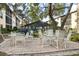 Patio area with multiple seating arrangements near the screened pool, perfect for relaxing and enjoying the community at 2280 Stickney Point Rd # 420, Sarasota, FL 34231