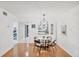 Cozy dining room featuring modern lighting and a seamless flow to the kitchen at 2280 Stickney Point Rd # 420, Sarasota, FL 34231