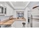 Well-lit kitchen features stainless steel appliances, granite counters, and convenient layout at 2280 Stickney Point Rd # 420, Sarasota, FL 34231