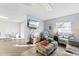 Open-concept living space with neutral tones, hardwood floors, and comfortable seating and lighting at 2280 Stickney Point Rd # 420, Sarasota, FL 34231