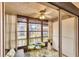 Relaxing porch area features a comfortable seating arrangement with a bright, airy atmosphere at 2280 Stickney Point Rd # 420, Sarasota, FL 34231