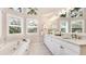 Bright bathroom boasts a soaking tub, granite countertops, and plantation shutters for added privacy at 2306 64Th W St # 17, Bradenton, FL 34209