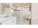 Beautiful bathroom with granite counters, glass shower, and separate toilet room, offering a clean, modern design at 2306 64Th W St # 17, Bradenton, FL 34209