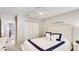 Well-lit bedroom with a cozy bed, closet, and access to another room, perfect for relaxation at 2306 64Th W St # 17, Bradenton, FL 34209