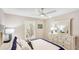 Bright bedroom features plantation shutters, soft lighting, and nautical decor for a serene atmosphere at 2306 64Th W St # 17, Bradenton, FL 34209