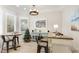 Cozy dining area with natural light, stylish lighting, and modern decor at 2306 64Th W St # 17, Bradenton, FL 34209