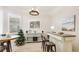 Bright dining area with a decorative Christmas tree and modern decor at 2306 64Th W St # 17, Bradenton, FL 34209