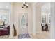 Welcoming foyer with wood floors, decorative door, and natural light at 2306 64Th W St # 17, Bradenton, FL 34209