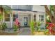 Inviting front entrance with an American flag, lush landscaping, and decorative trim at 2306 64Th W St # 17, Bradenton, FL 34209