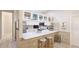 This contemporary kitchen offers a breakfast bar, tile backsplash, and views to the backyard at 2306 64Th W St # 17, Bradenton, FL 34209