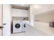 Functional laundry room with ample storage, counter space, and modern washer and dryer units at 2306 64Th W St # 17, Bradenton, FL 34209