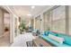 Inviting sunroom featuring tile floors, serene decor, and French doors that connect to the home at 2306 64Th W St # 17, Bradenton, FL 34209