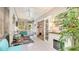 Bright sunroom features tile flooring, a ceiling fan, fireplace, and comfortable seating with views of the outdoors at 2306 64Th W St # 17, Bradenton, FL 34209