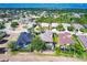 Aerial view of homes in a suburban neighborhood with well-maintained yards and mature trees at 235 Dahlia Ct, Bradenton, FL 34212