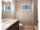 Bathroom with a vanity, tile flooring, and a window allowing plenty of natural light at 235 Dahlia Ct, Bradenton, FL 34212