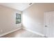 Bedroom featuring laminate floors, one window offering natural light, and a closet at 235 Dahlia Ct, Bradenton, FL 34212