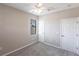 Cozy bedroom with neutral walls, plush carpeting, and a window letting in natural light at 235 Dahlia Ct, Bradenton, FL 34212