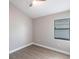 Bedroom featuring laminate floors, a ceiling fan, and one window offering natural light and serene views at 235 Dahlia Ct, Bradenton, FL 34212