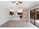 Open-concept living area showcasing modern floors and a breakfast bar overlooking the kitchen at 235 Dahlia Ct, Bradenton, FL 34212