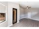 Bright living space showcasing sleek floors, a ceiling fan, and access to an outdoor balcony at 235 Dahlia Ct, Bradenton, FL 34212