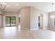 Bright living space boasting tile floors, arched doorways, and views of the pool area at 235 Dahlia Ct, Bradenton, FL 34212