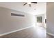 Bright and open living area with modern flooring and natural light from the windows at 235 Dahlia Ct, Bradenton, FL 34212