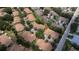 Aerial view of a community featuring well-maintained homes and lush landscaping from above at 2407 New Haven Cir, Sun City Center, FL 33573