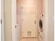 Functional laundry area with modern appliances, featuring easy access to the outside at 2407 New Haven Cir, Sun City Center, FL 33573