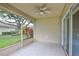 Enclosed patio with tile floor, ceiling fan, and sliding doors to the outdoor living space at 2407 New Haven Cir, Sun City Center, FL 33573