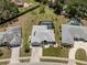 Charming single Gathering home featuring a spacious lawn, attached garage, and screened-in backyard pool at 245 Woodingham Trl, Venice, FL 34292