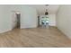 Open living room boasts wood floors, natural light, and an inviting atmosphere at 245 Woodingham Trl, Venice, FL 34292
