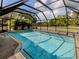 Inviting screened-in pool with a pristine surface, perfect for enjoying sunny days in a private setting at 245 Woodingham Trl, Venice, FL 34292