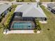 Backyard features a screened-in pool, fenced-in yard, and spacious backyard at 245 Woodingham Trl, Venice, FL 34292