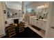 Modern bathroom with dual vanities, framed mirrors, and glass-enclosed shower at 25240 Keygrass Ct, Punta Gorda, FL 33955