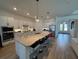 Bright and airy kitchen featuring a large island, stainless steel appliances, and ample counter space at 25240 Keygrass Ct, Punta Gorda, FL 33955