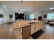 Modern kitchen with a granite island, stainless steel appliances, and stylish cabinetry at 25240 Keygrass Ct, Punta Gorda, FL 33955