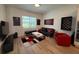 Cozy living room featuring tile floors, modern decor, and comfortable seating arrangement at 25240 Keygrass Ct, Punta Gorda, FL 33955