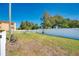 Fully fenced community dog park with space for pets to play, surrounded by lush grass and mature trees at 3447 Clark Rd # 246, Sarasota, FL 34231