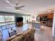 Open-concept living space with modern tile flooring, balcony access, eat in kitchen, and stainless steel appliances at 3447 Clark Rd # 246, Sarasota, FL 34231