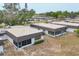 Aerial shot of condo community, featuring meticulously maintained lawns, and mature shade trees at 3941 Glen Oaks E Dr # 32, Sarasota, FL 34232