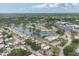 Panoramic aerial view of a tranquil community with a scenic lake, surrounded by lush greenery and well-maintained homes at 3941 Glen Oaks E Dr # 32, Sarasota, FL 34232