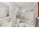 Bathroom boasts shower, tub, and vanity with neutral wall paint at 3941 Glen Oaks E Dr # 32, Sarasota, FL 34232