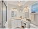 Bright bathroom with tiled floors, granite vanity and glass shower at 3941 Glen Oaks E Dr # 32, Sarasota, FL 34232