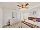 Bedroom featuring a large dresser, a plush bed, and a ceiling fan at 3941 Glen Oaks E Dr # 32, Sarasota, FL 34232