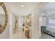 Hallway with stylish decorations, leading to bedrooms and living areas, showcasing the home's layout at 3941 Glen Oaks E Dr # 32, Sarasota, FL 34232