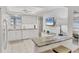 Charming kitchen with white subway tile backsplash, granite countertops, and stainless steel appliances at 3941 Glen Oaks E Dr # 32, Sarasota, FL 34232
