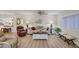 Spacious living room with ceiling fan, vinyl flooring, and comfortable seating at 3941 Glen Oaks E Dr # 32, Sarasota, FL 34232